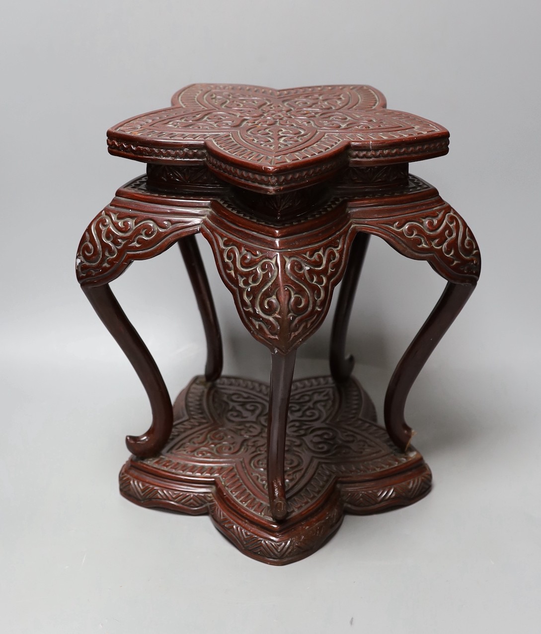 A Chinese lacquered wood stand, 30cm tall